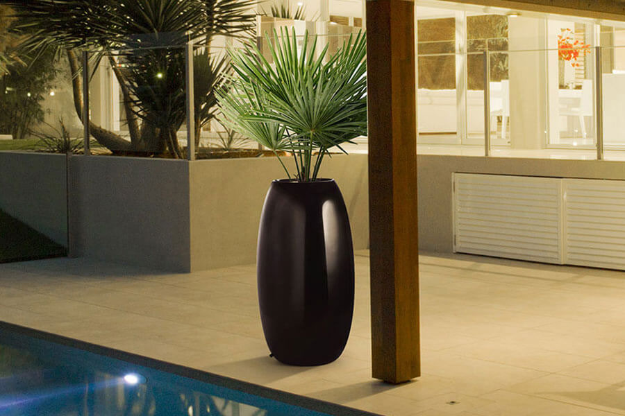 black tall FRP planter placed in the verandah