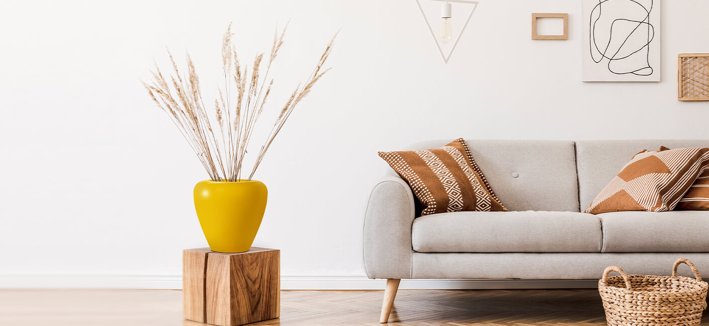 Flower Pot in yellow colour placed in living room
