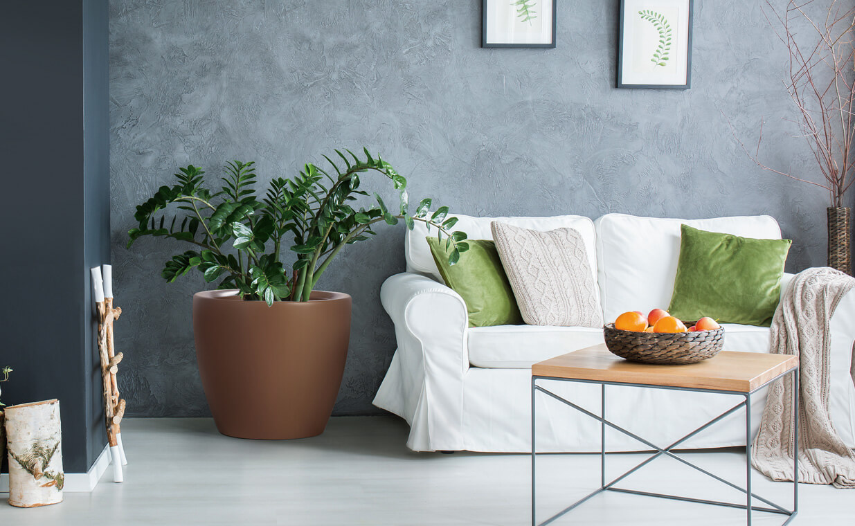 brown rustic finish fiberglass planter placed in living room