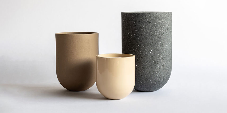 Oval planter in gloss, rustic and textured finish placed besides each other