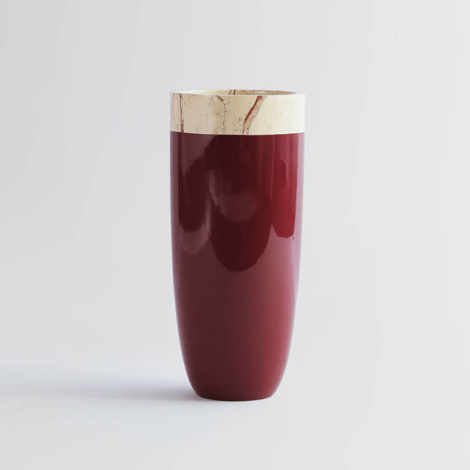 red bullet shaped tall planter